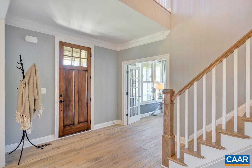 2134 Ridgetop Drive Charlottesville, VA 22903 - Photo 5 of 49 a view of entryway with wooden floor and stairs