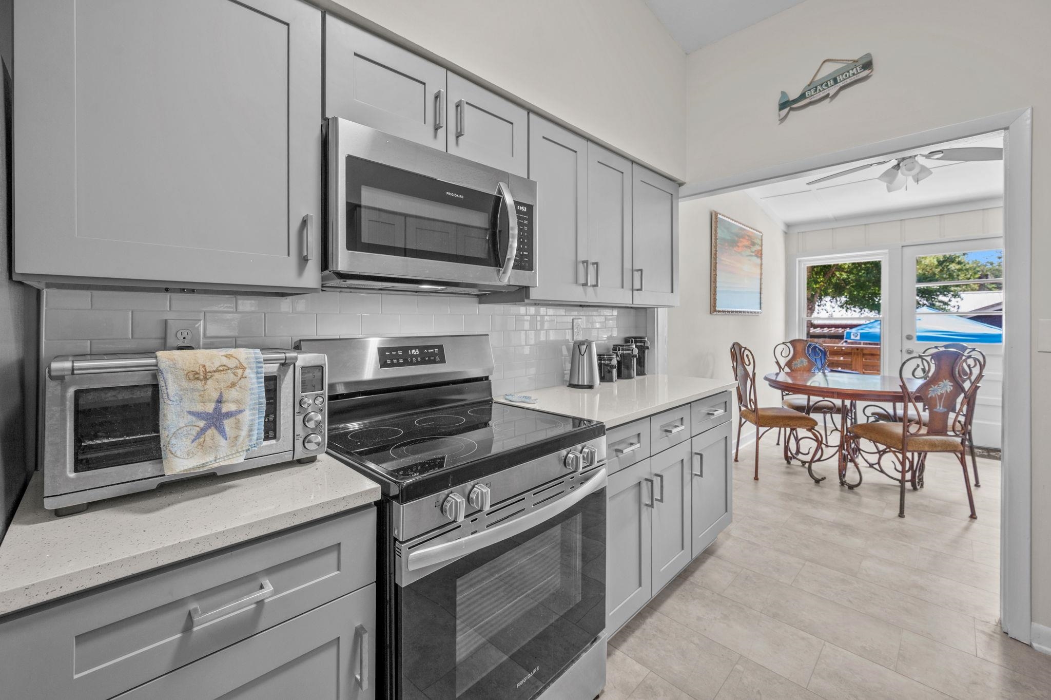 507 Gentian Road St. Augustine, FL 32086 - Photo 15 of 82 a kitchen with stainless steel appliances granite countertop a stove microwave and cabinets