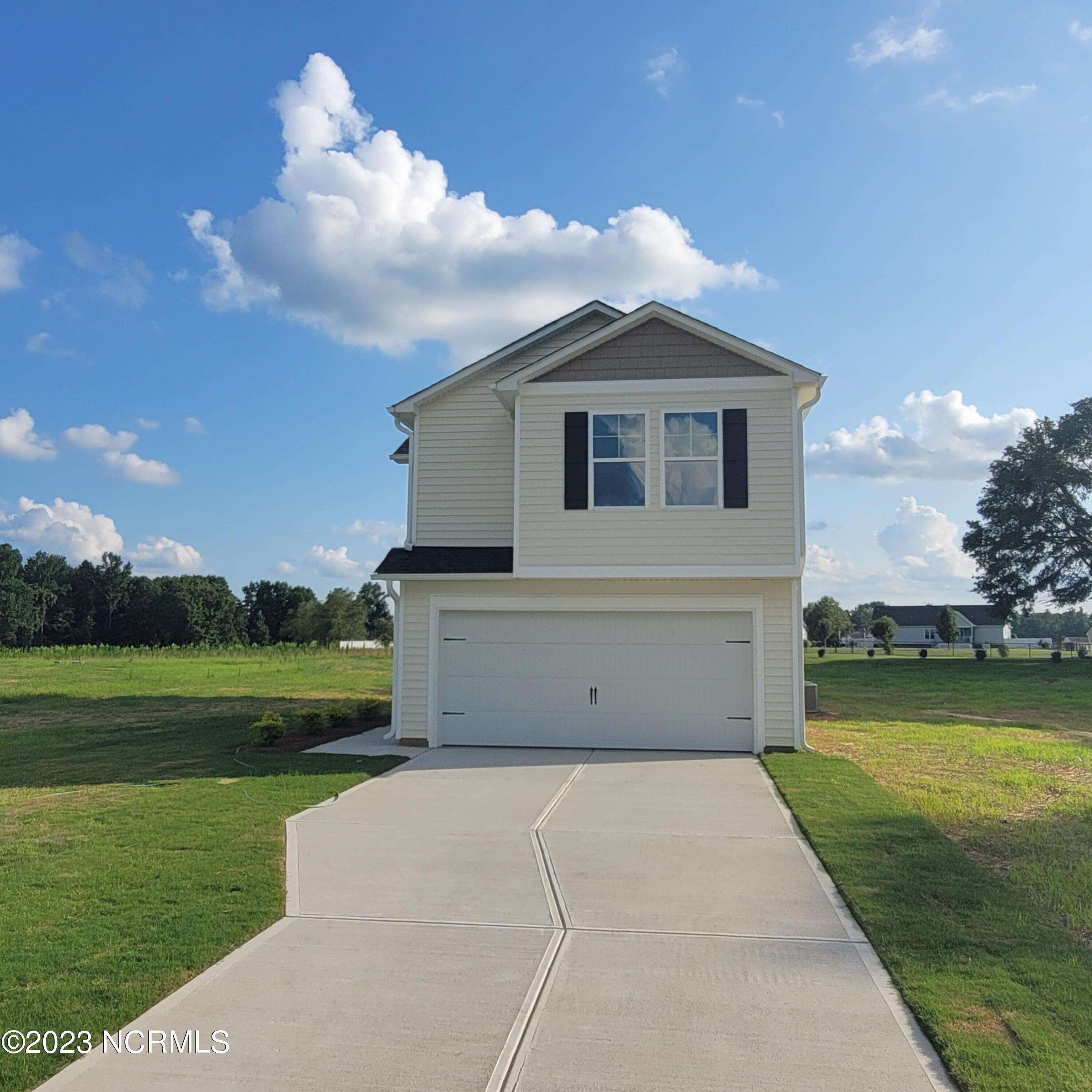 4097 Cordiality Church Road Nashville, NC 27856 - Photo 1 of 5 2 car garage and driveway situated on a large lot.