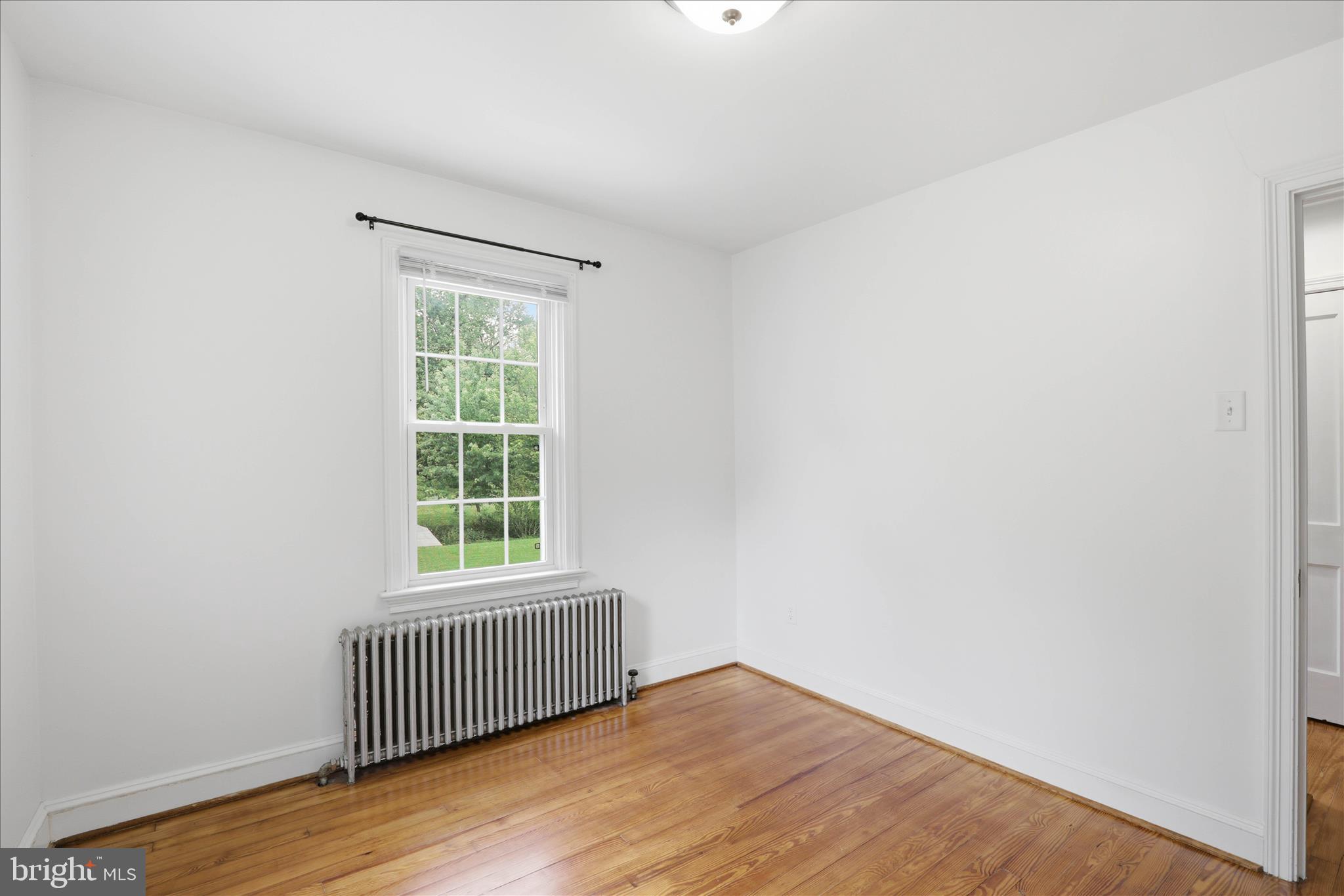 169 School House Road Lancaster, PA 17603 - Photo 22 of 39 an empty room with wooden floor and windows