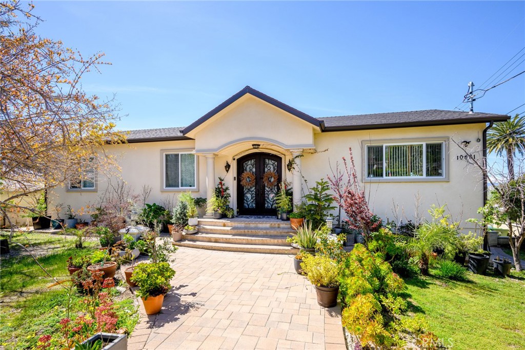10461 Hillhaven Avenue Tujunga, CA 91042 - Photo 1 of 31 a front view of a house with a yard