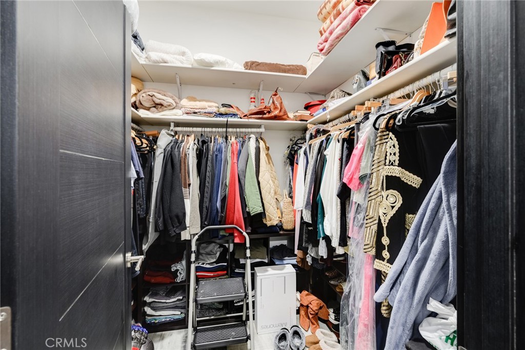 10461 Hillhaven Avenue Tujunga, CA 91042 - Photo 12 of 31 a view of walk in closet with clothes and shoes
