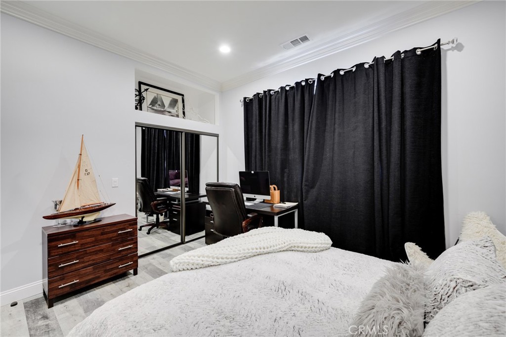 10461 Hillhaven Avenue Tujunga, CA 91042 - Photo 17 of 31 a bedroom with a bed and a dresser
