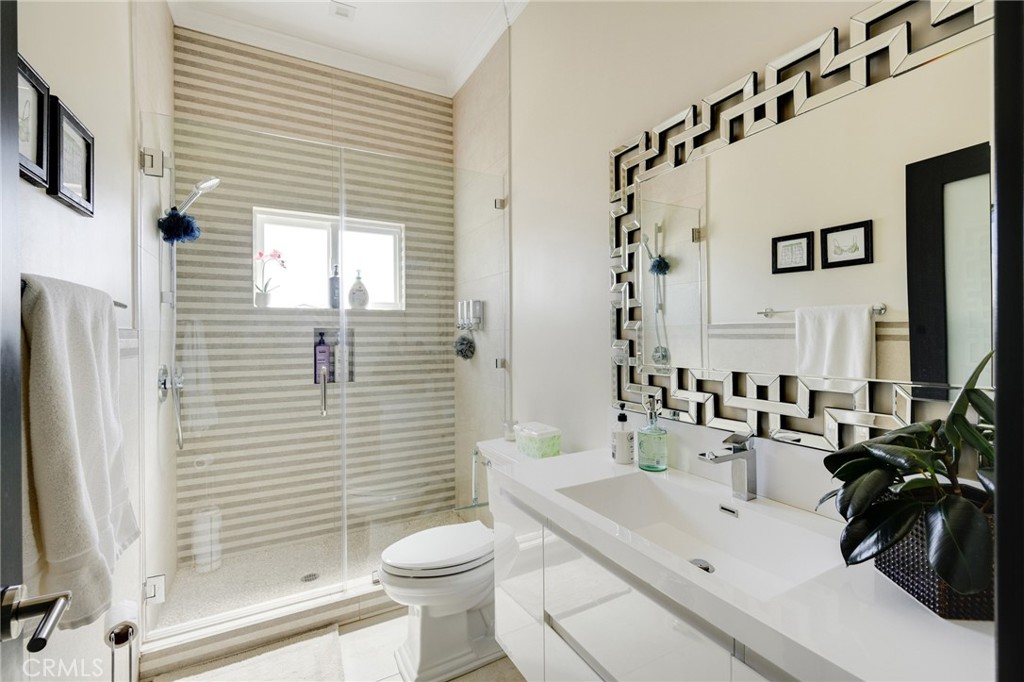10461 Hillhaven Avenue Tujunga, CA 91042 - Photo 18 of 31 a bathroom with a sink a toilet and shower
