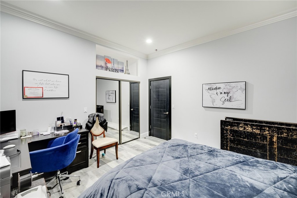 10461 Hillhaven Avenue Tujunga, CA 91042 - Photo 20 of 31 a bed room with a bed and a television