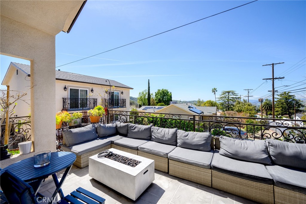 10461 Hillhaven Avenue Tujunga, CA 91042 - Photo 23 of 31 a living room with furniture and a couch