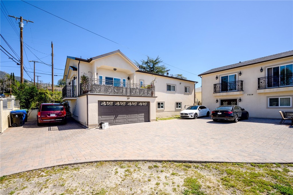 10461 Hillhaven Avenue Tujunga, CA 91042 - Photo 27 of 31 a view of a house with a patio and a yard