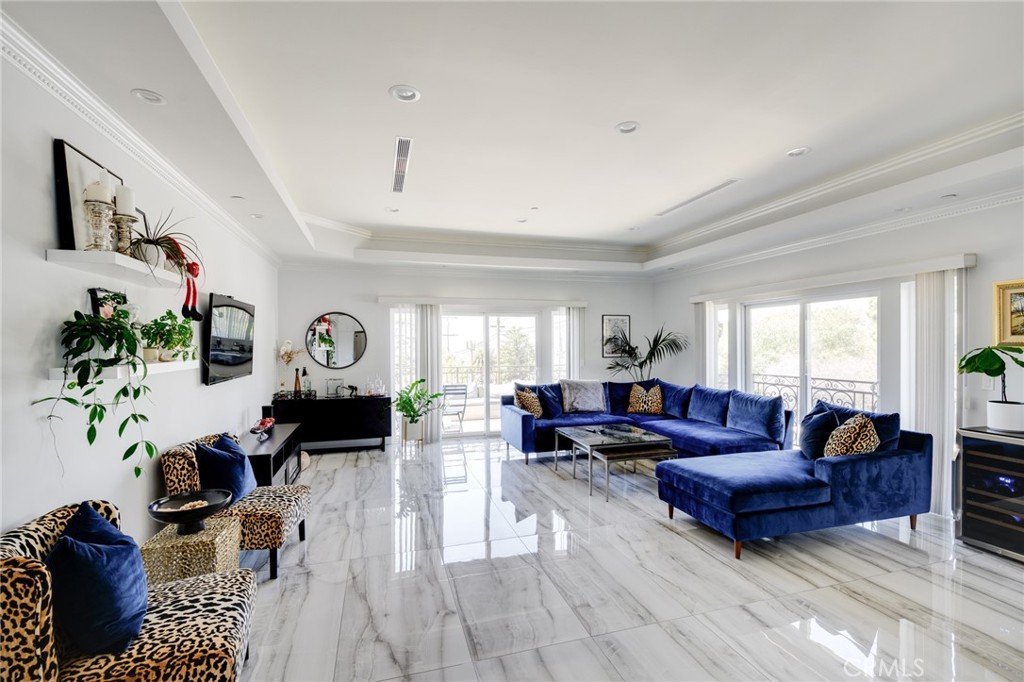 10461 Hillhaven Avenue Tujunga, CA 91042 - Photo 3 of 31 a living room with furniture large window and flat screen tv