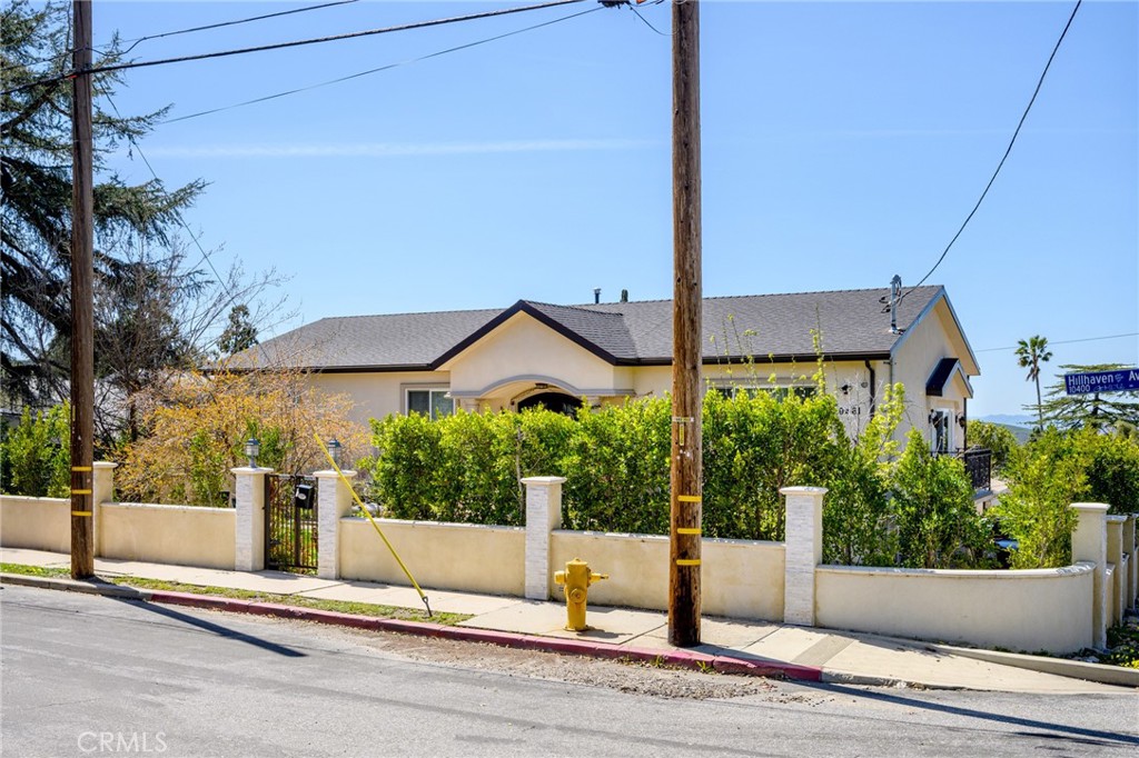 10461 Hillhaven Avenue Tujunga, CA 91042 - Photo 31 of 31 a view of tall house with a street