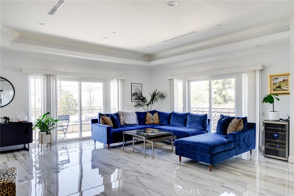 10461 Hillhaven Avenue Tujunga, CA 91042 - Photo 5 of 31 a living room with furniture a table and a large window