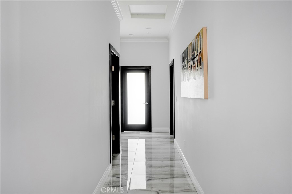 10461 Hillhaven Avenue Tujunga, CA 91042 - Photo 9 of 31 a view of a hallway with wooden floor and staircase