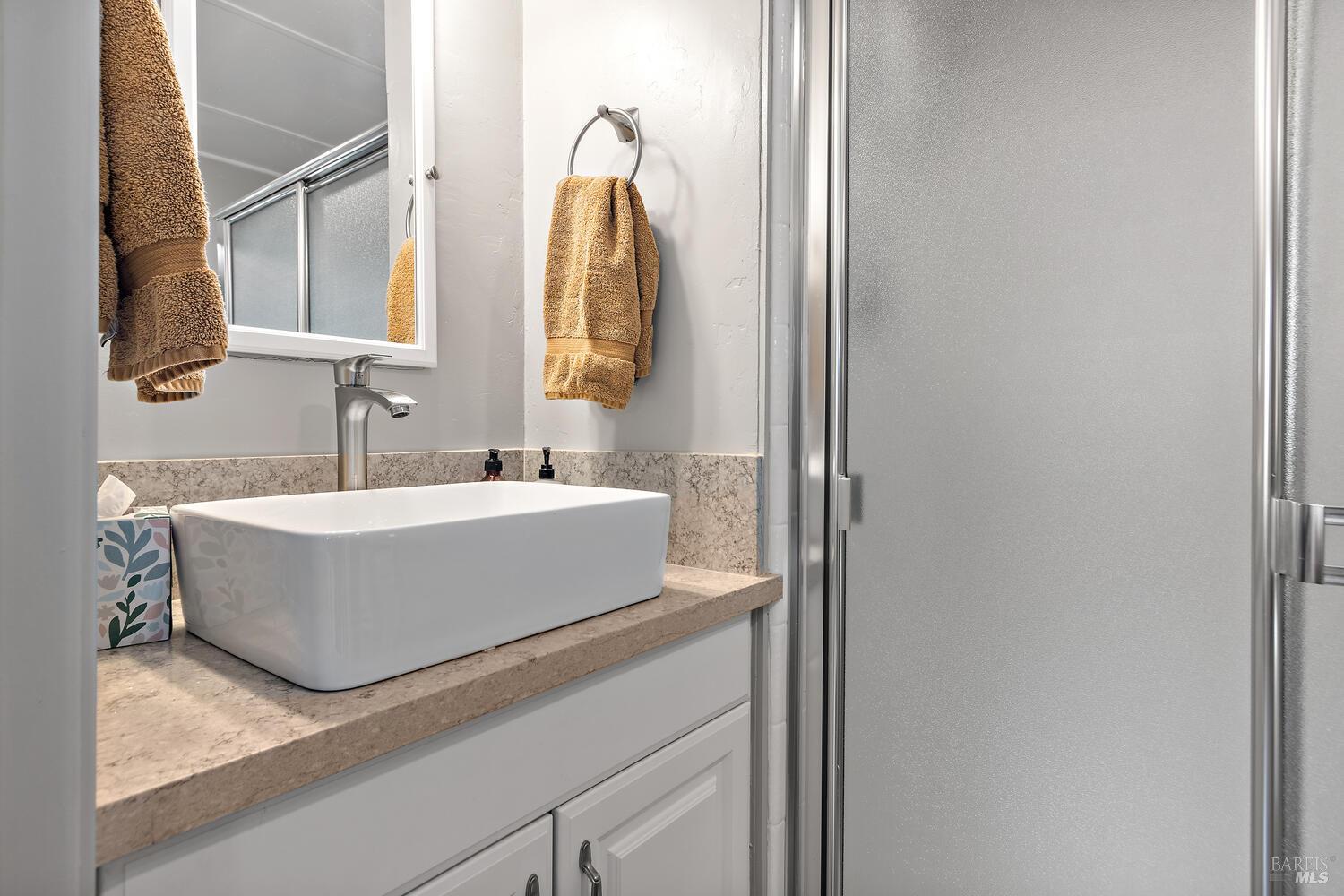 9 Sandy Beach Road Vallejo, CA 94590 - Photo 14 of 25 a bathroom with a sink and a mirror