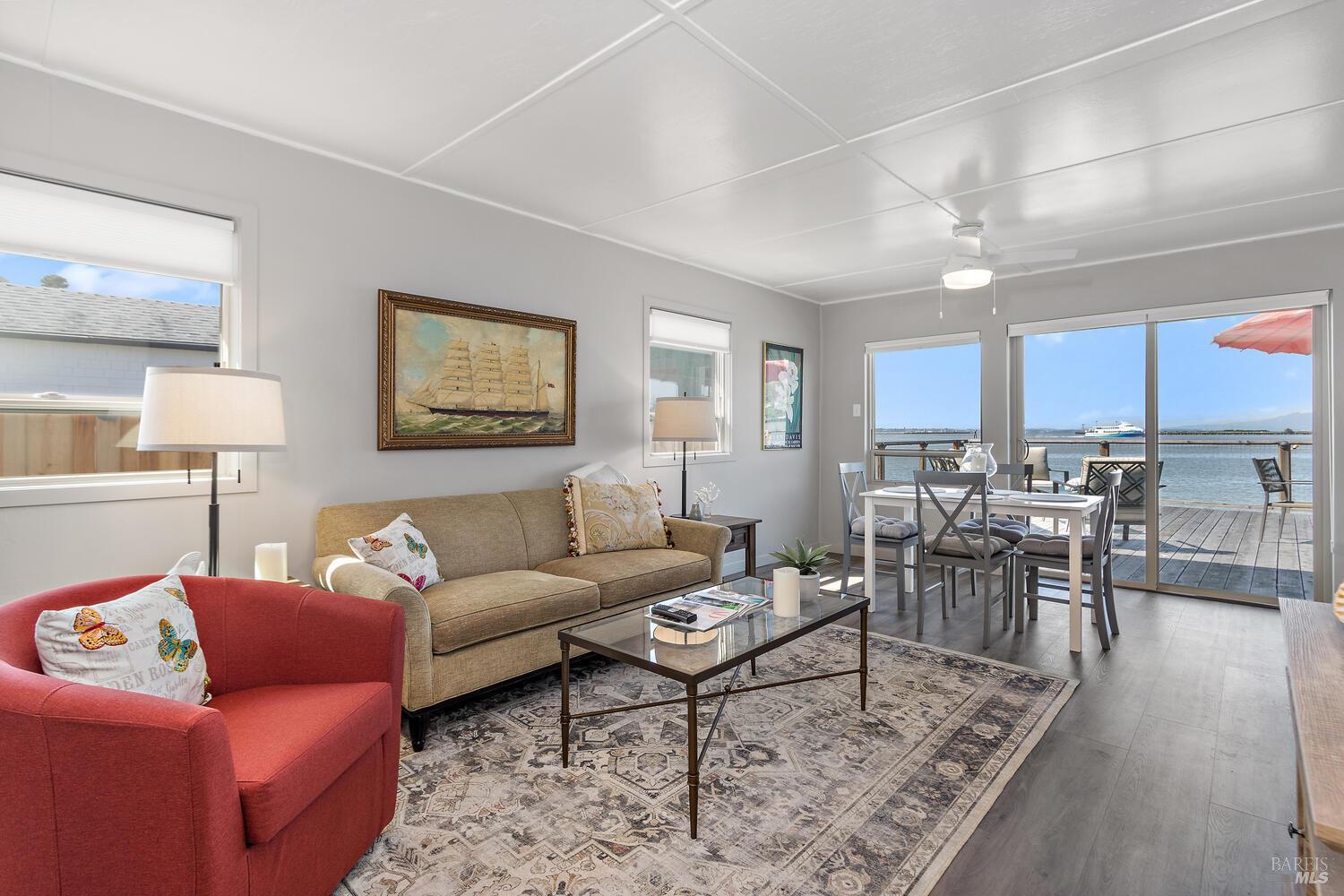 9 Sandy Beach Road Vallejo, CA 94590 - Photo 6 of 25 a living room with furniture a wooden floor and a view of kitchen