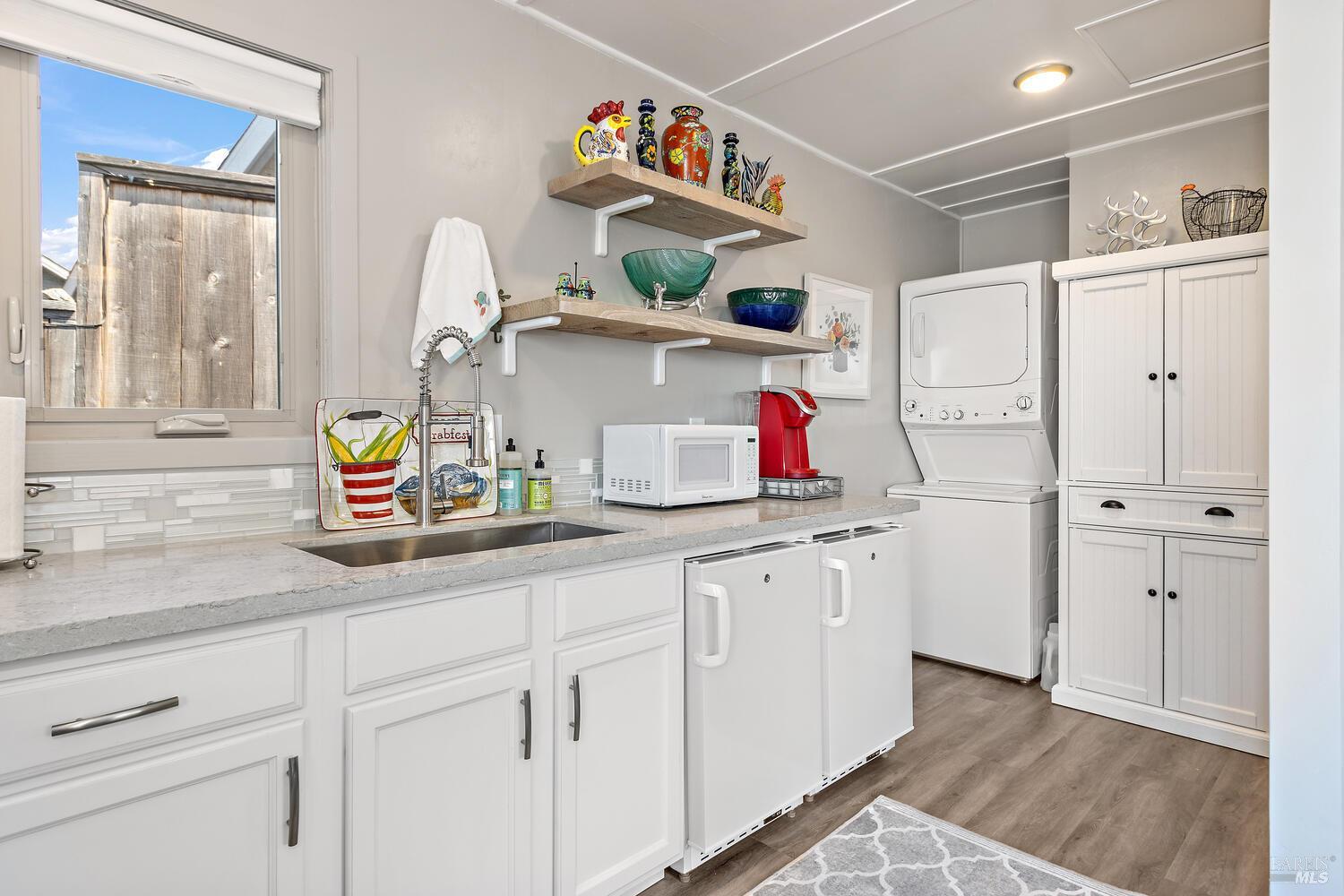 9 Sandy Beach Road Vallejo, CA 94590 - Photo 10 of 25 a kitchen with white cabinets and sink
