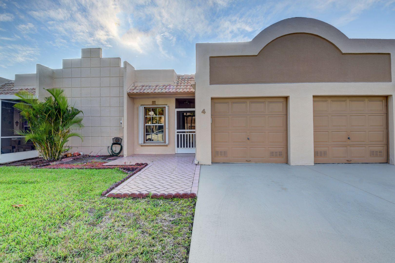 9124 Flynn Circle, Unit 4 Boca Raton, FL 33496 - Photo 3 of 34 front