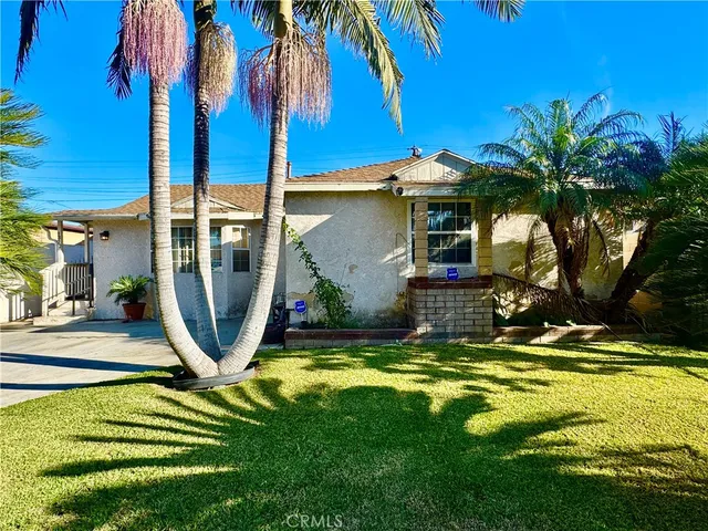 a view of swimming pool with a lawn chairs under an umbrella