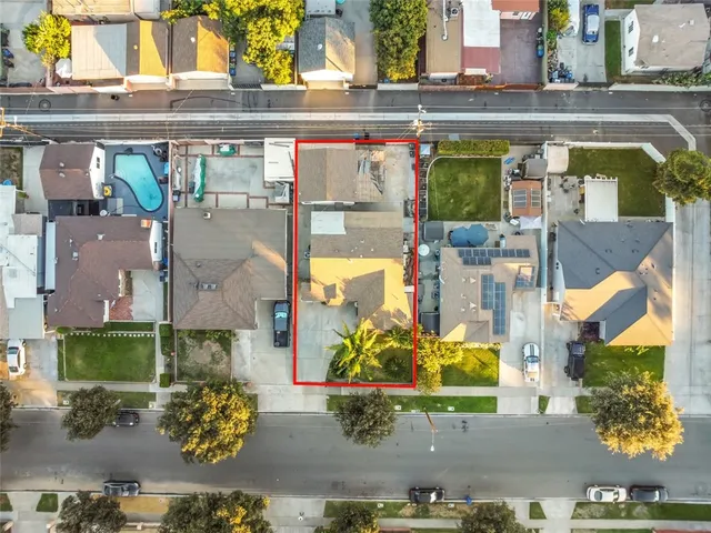 an aerial view of a balcony with chairs