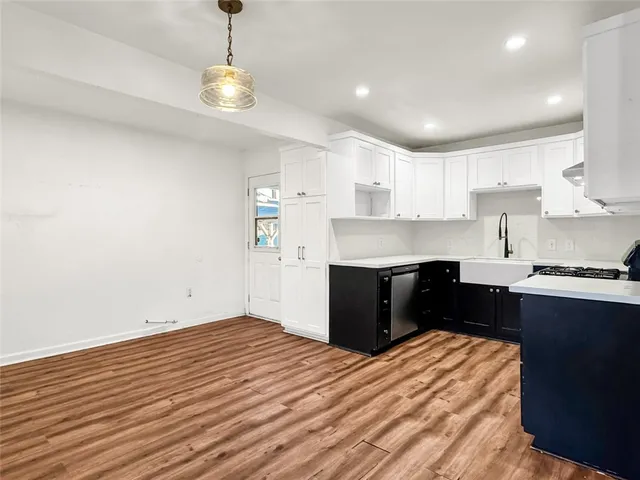 a kitchen with a sink and cabinets