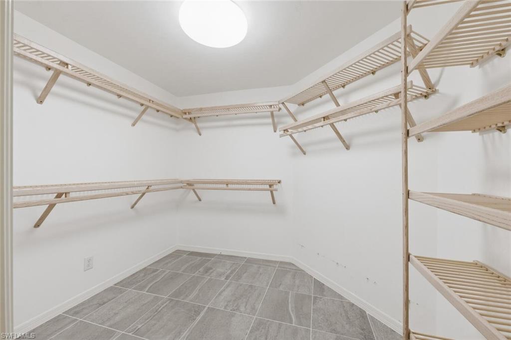 5356 Sycamore Drive Naples, FL 34119 - Photo 16 of 20 a view of a room with racks on the wall