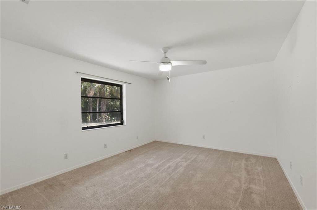 5356 Sycamore Drive Naples, FL 34119 - Photo 17 of 20 an empty room with a window