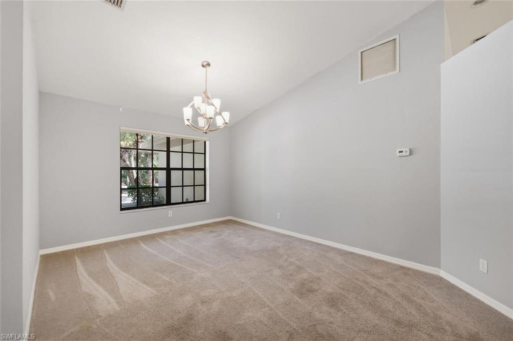 5356 Sycamore Drive Naples, FL 34119 - Photo 8 of 20 a view of an empty room with a window