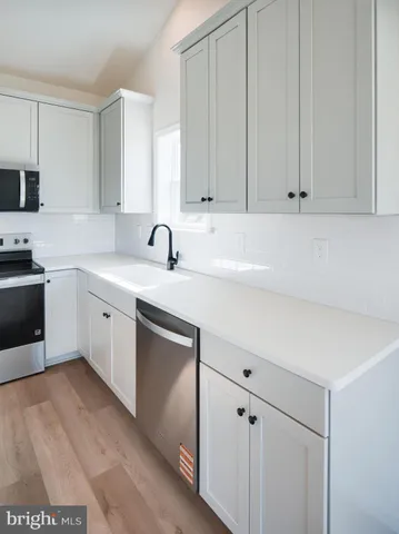 a view of a room with a ceiling fan