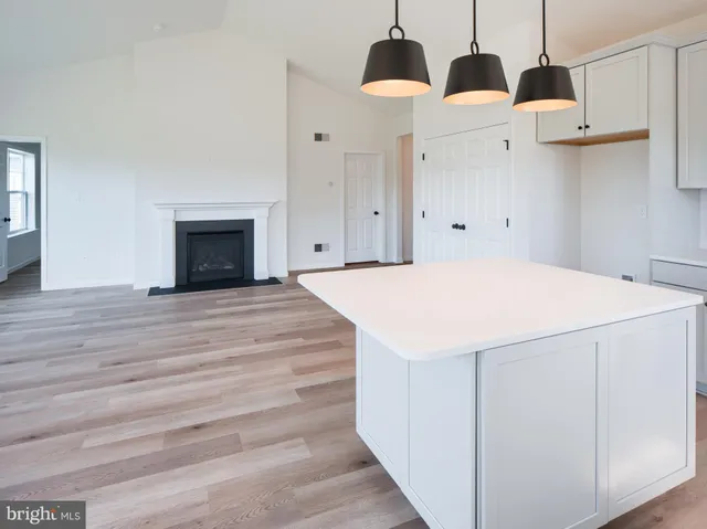 a spacious bathroom with double sink and a mirror