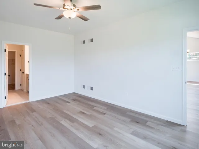 a bathroom with a double vanity sink and mirror