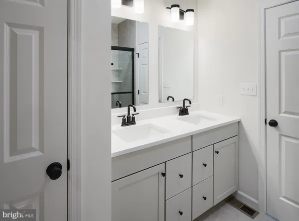 a white toilet sitting next to a bathroom sink
