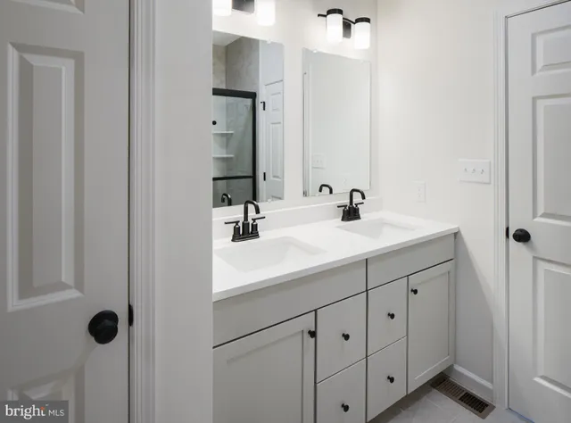 a white toilet sitting next to a bathroom sink