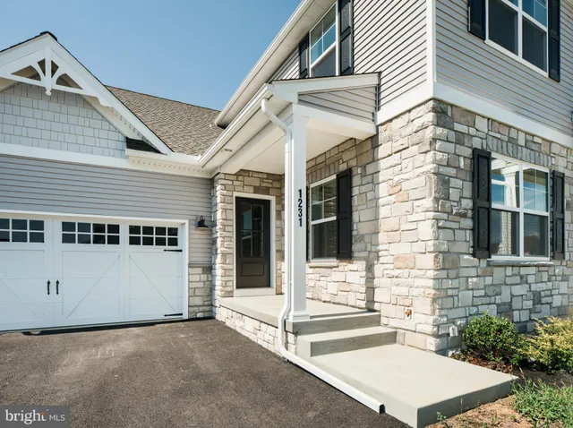 a view of house with yard