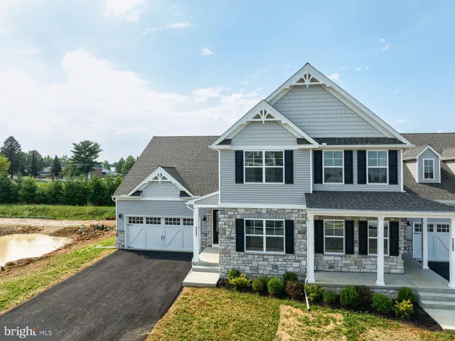 an aerial view of a house with outdoor space and street view