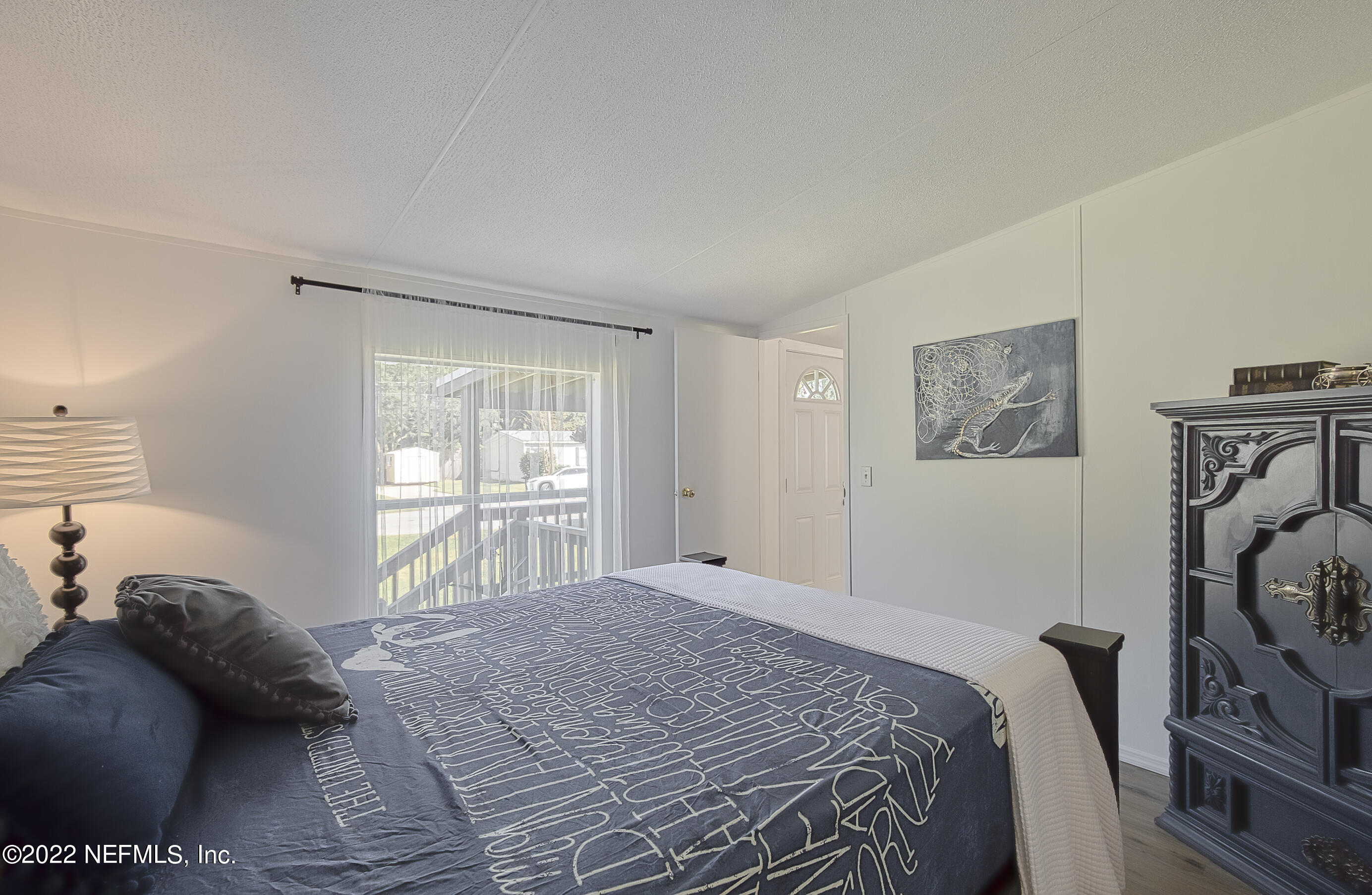 4509 De Leon Place St. Augustine, FL 32095 - Photo 16 of 35 a bedroom with a bed and a window