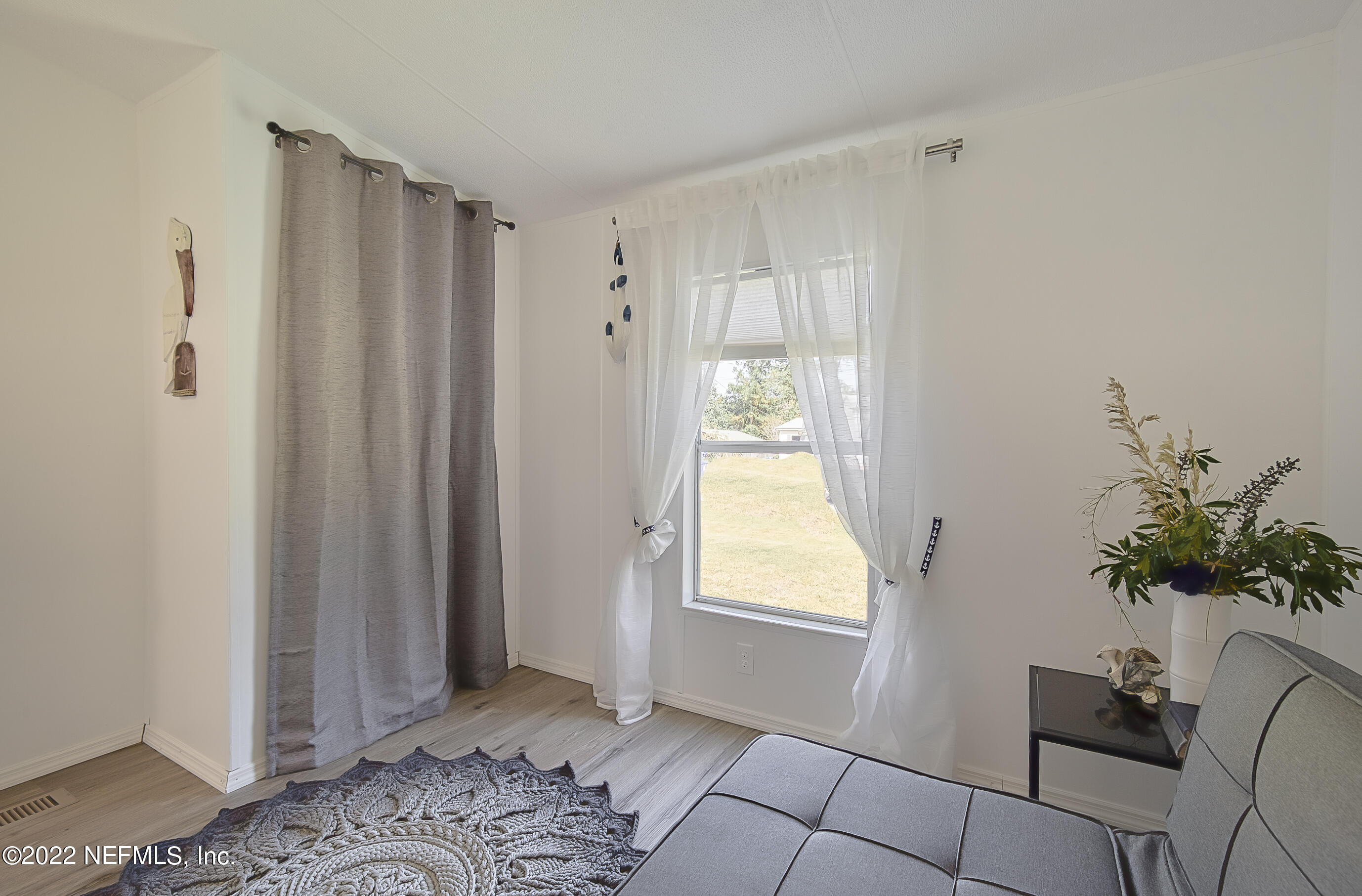 4509 De Leon Place St. Augustine, FL 32095 - Photo 22 of 35 a view of bedroom with window and front door