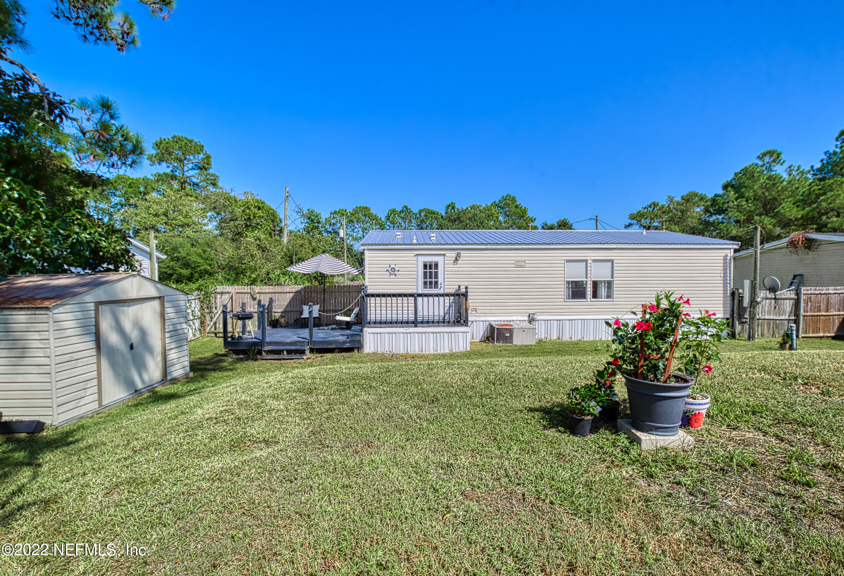 4509 De Leon Place St. Augustine, FL 32095 - Photo 26 of 35 a view of a house with a yard porch and sitting area