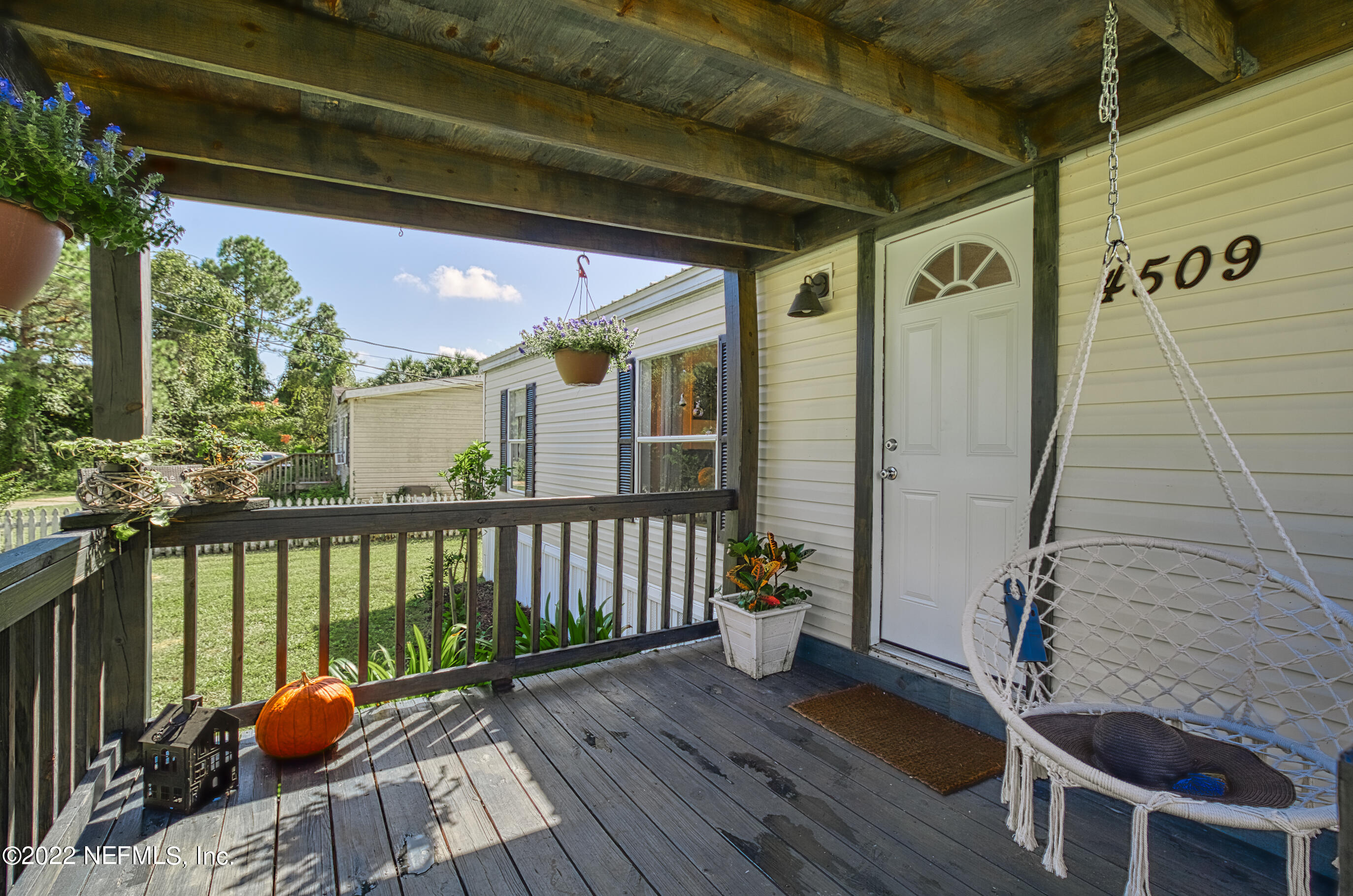 4509 De Leon Place St. Augustine, FL 32095 - Photo 29 of 35 a view of balcony with wooden floor and furniture