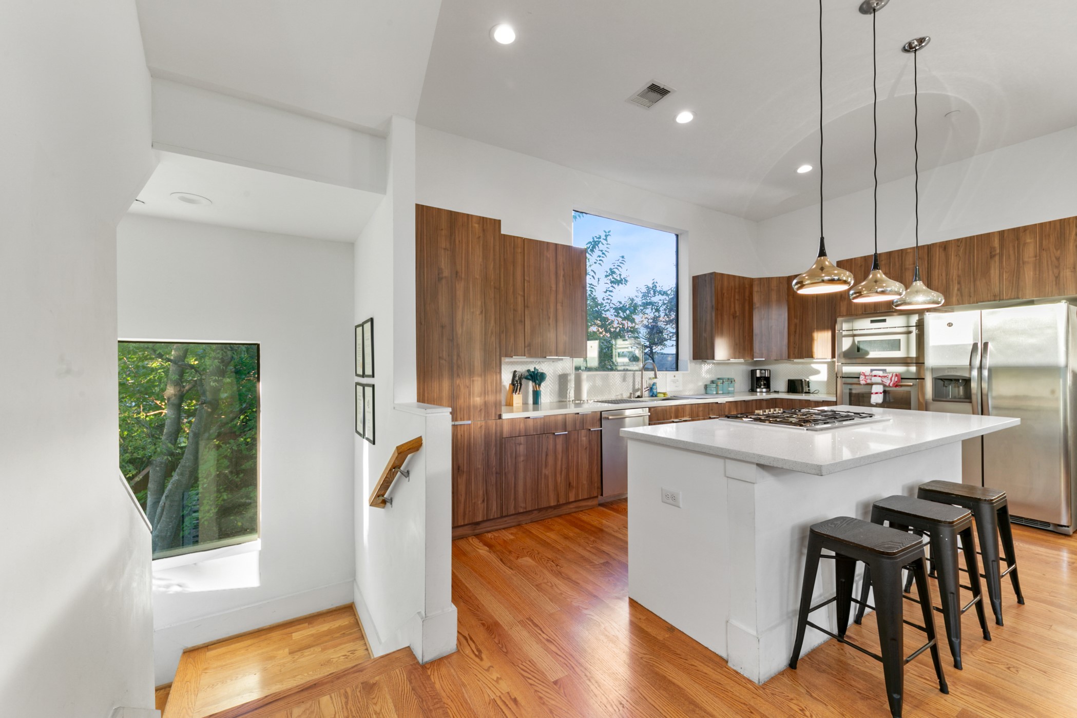 608 Oakley Street Houston, TX 77006 - Photo 14 of 37 a kitchen with counter top space a sink appliances and cabinets
