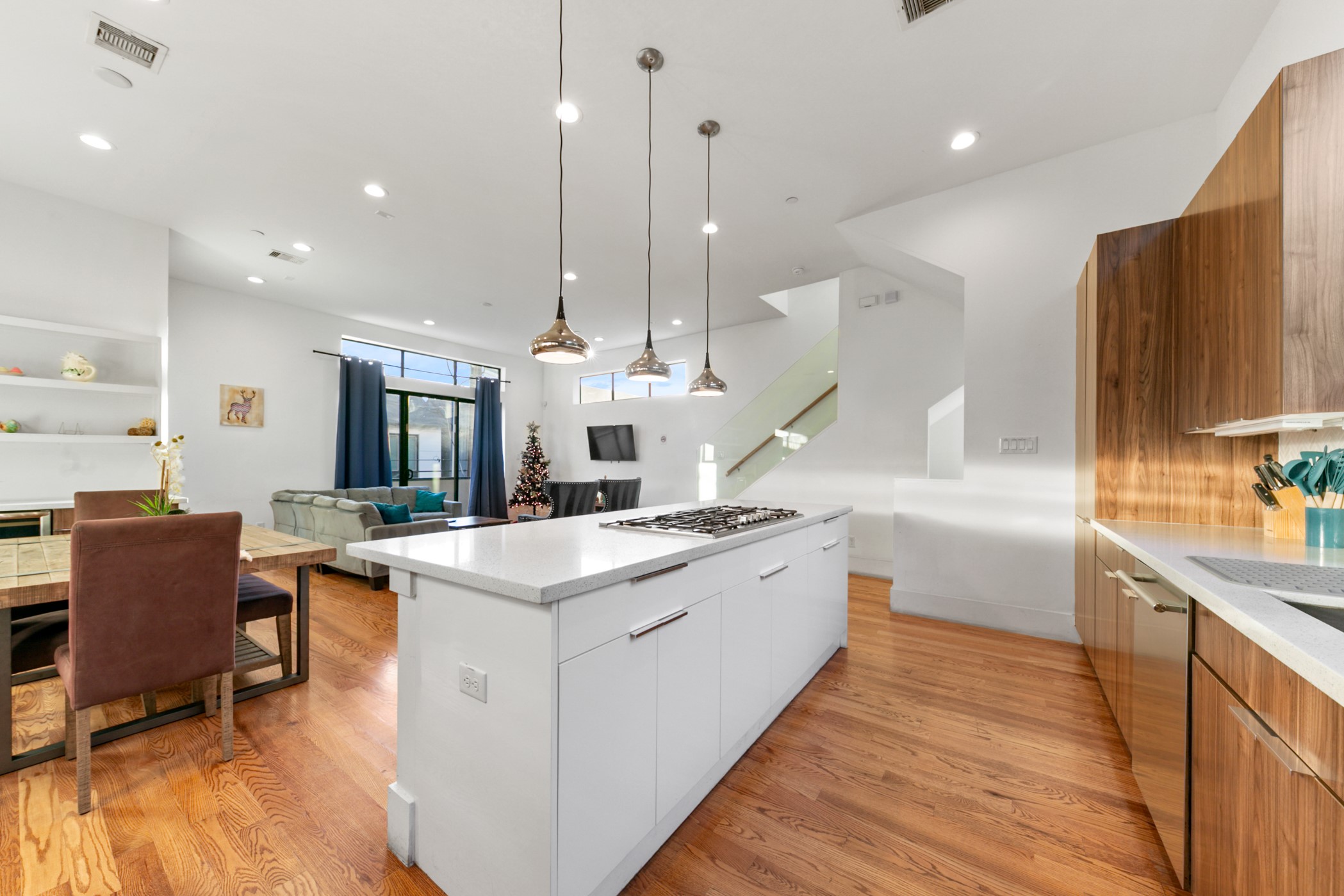 608 Oakley Street Houston, TX 77006 - Photo 16 of 37 a large kitchen with stainless steel appliances kitchen island granite countertop a sink and a stove top oven with wooden floor