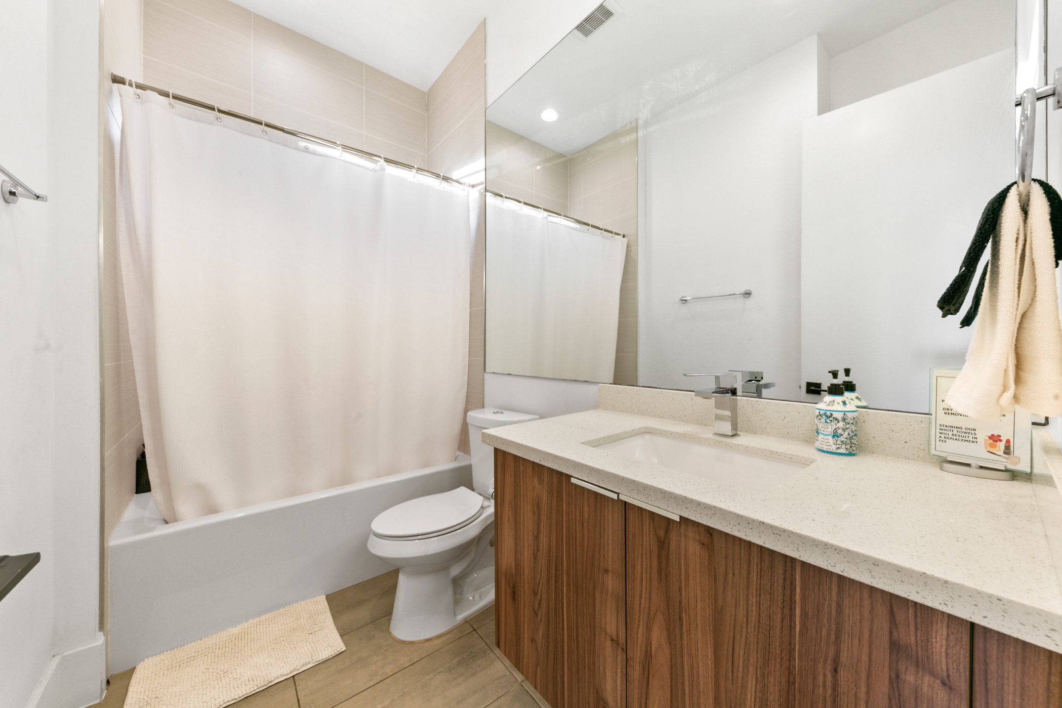 608 Oakley Street Houston, TX 77006 - Photo 30 of 37 a bathroom with a sink a toilet and a mirror