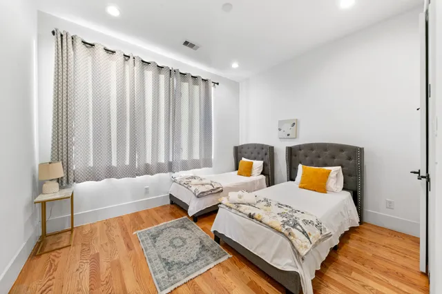 a bedroom with bed and window