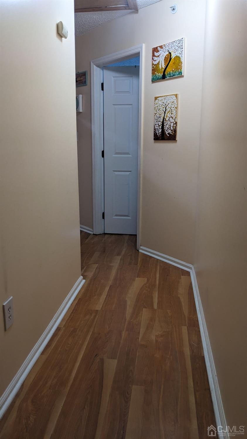 7 Newburgh Drive Edison, NJ 08820 - Photo 14 of 20 a view of storage and utility room with wooden floor
