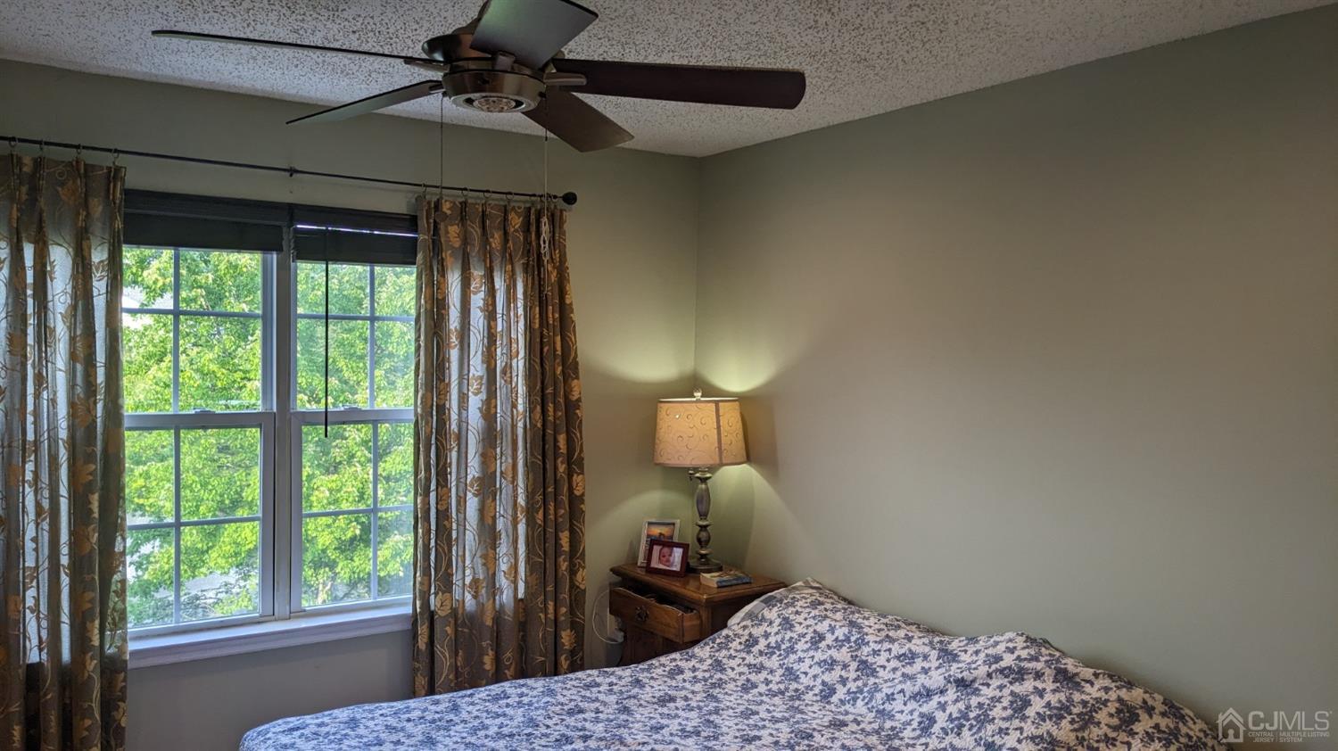 7 Newburgh Drive Edison, NJ 08820 - Photo 15 of 20 a bedroom with a bed and a chandelier