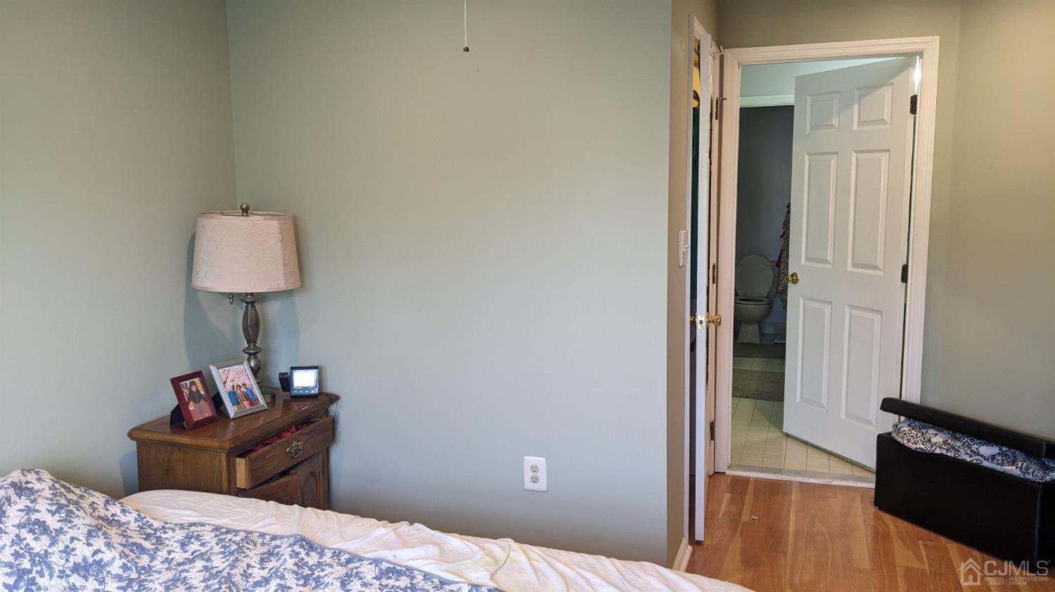 7 Newburgh Drive Edison, NJ 08820 - Photo 16 of 20 a bedroom with a bed and a lamp on table