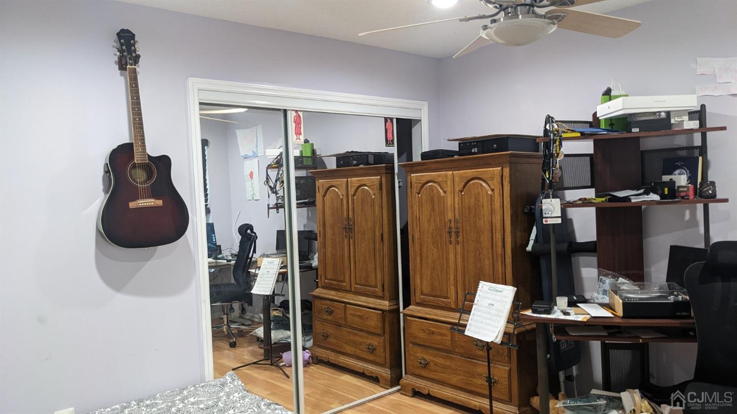 7 Newburgh Drive Edison, NJ 08820 - Photo 19 of 20 a view of walk in closet with clothes and shoes