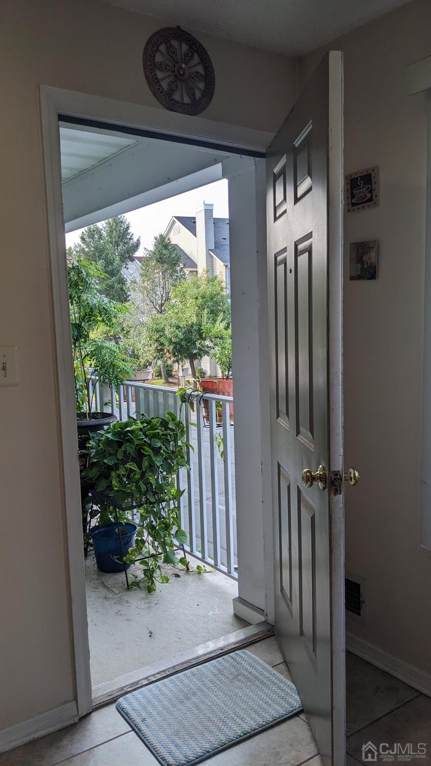 7 Newburgh Drive Edison, NJ 08820 - Photo 20 of 20 a view of a hallway with wooden floor and a plant