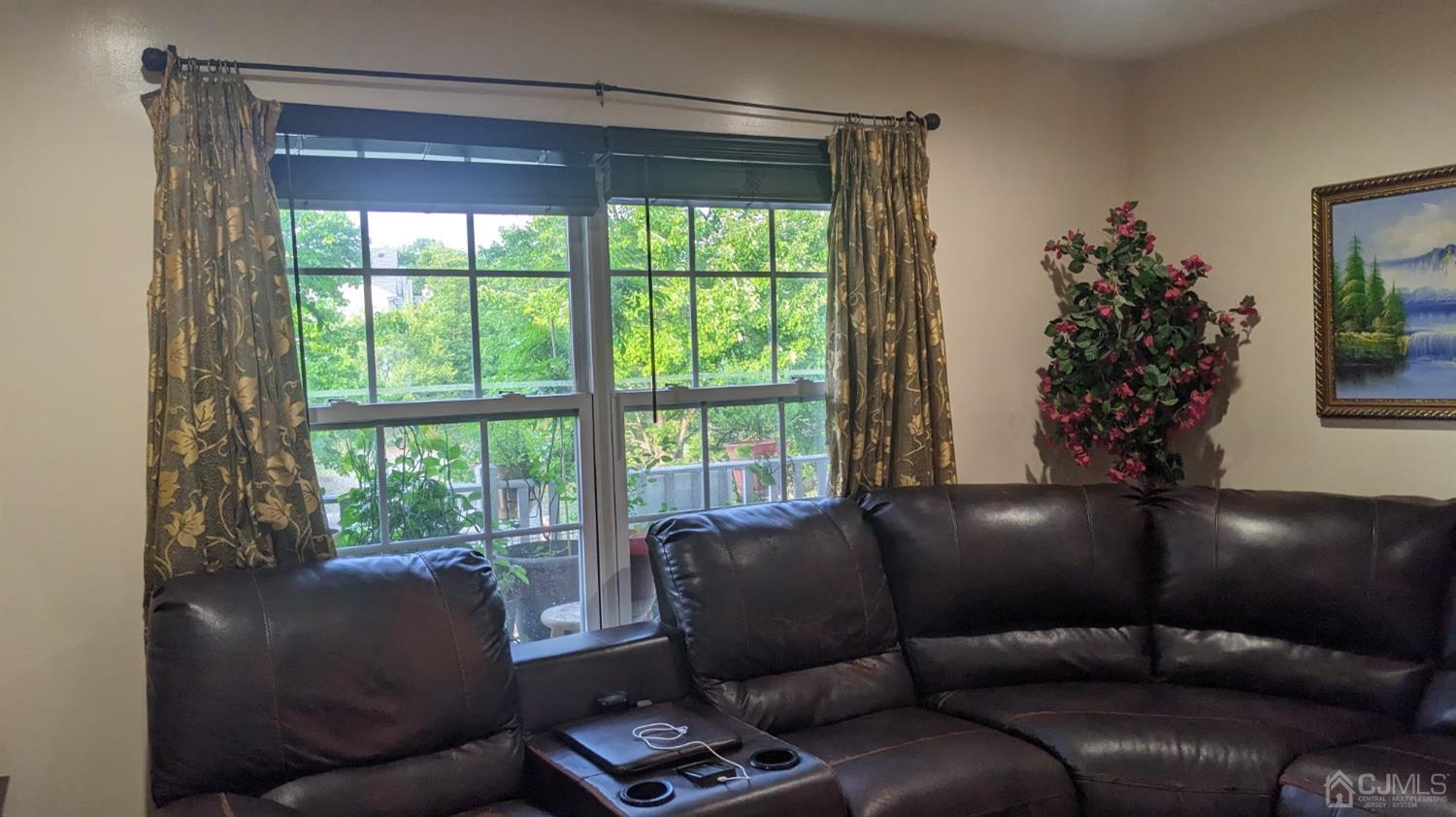 7 Newburgh Drive Edison, NJ 08820 - Photo 7 of 20 a living room with furniture and a large window