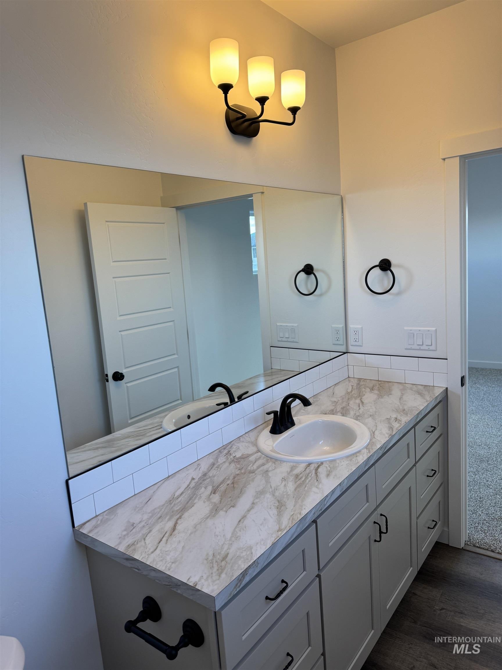 2008 Harrison Street South Twin Falls, ID 83301 - Photo 17 of 32 Bathroom with vanity and dark wood-type flooring