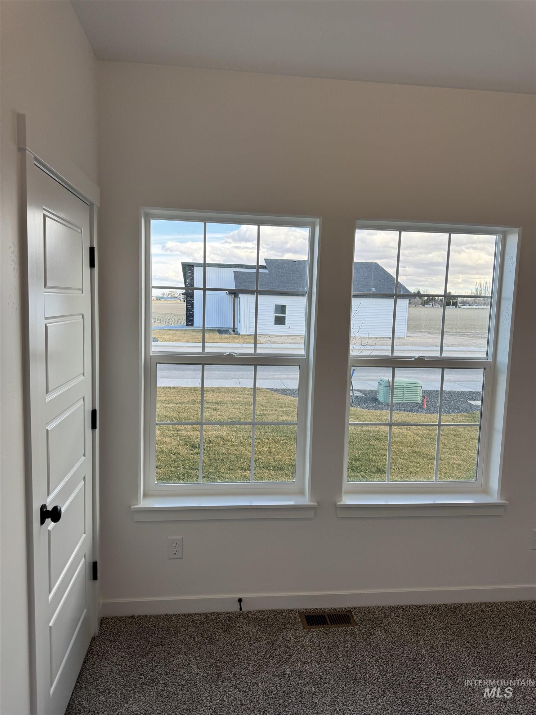 2008 Harrison Street South Twin Falls, ID 83301 - Photo 18 of 32 Unfurnished room with baseboards and dark colored carpet