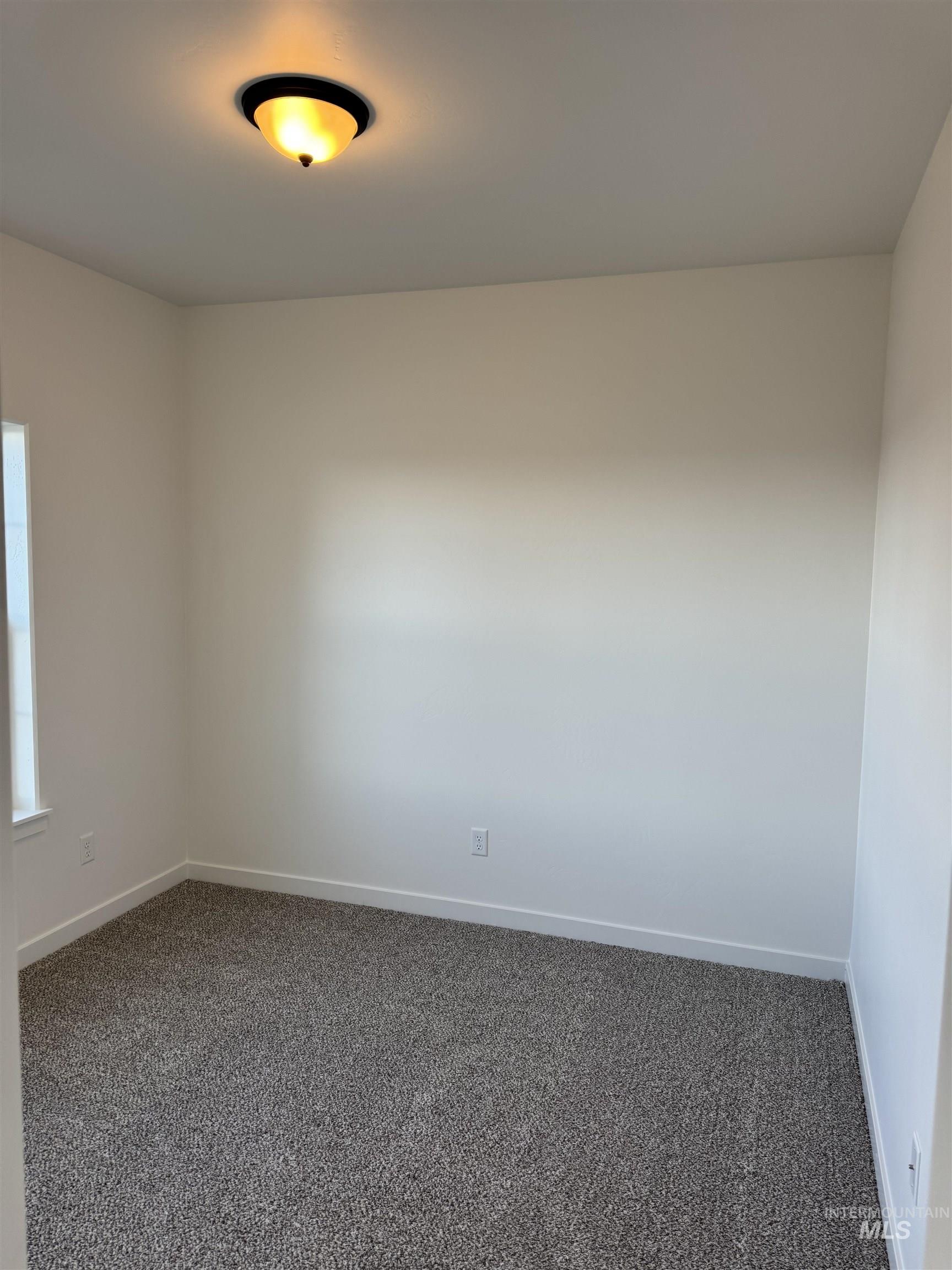 2008 Harrison Street South Twin Falls, ID 83301 - Photo 19 of 32 Carpeted spare room featuring baseboards