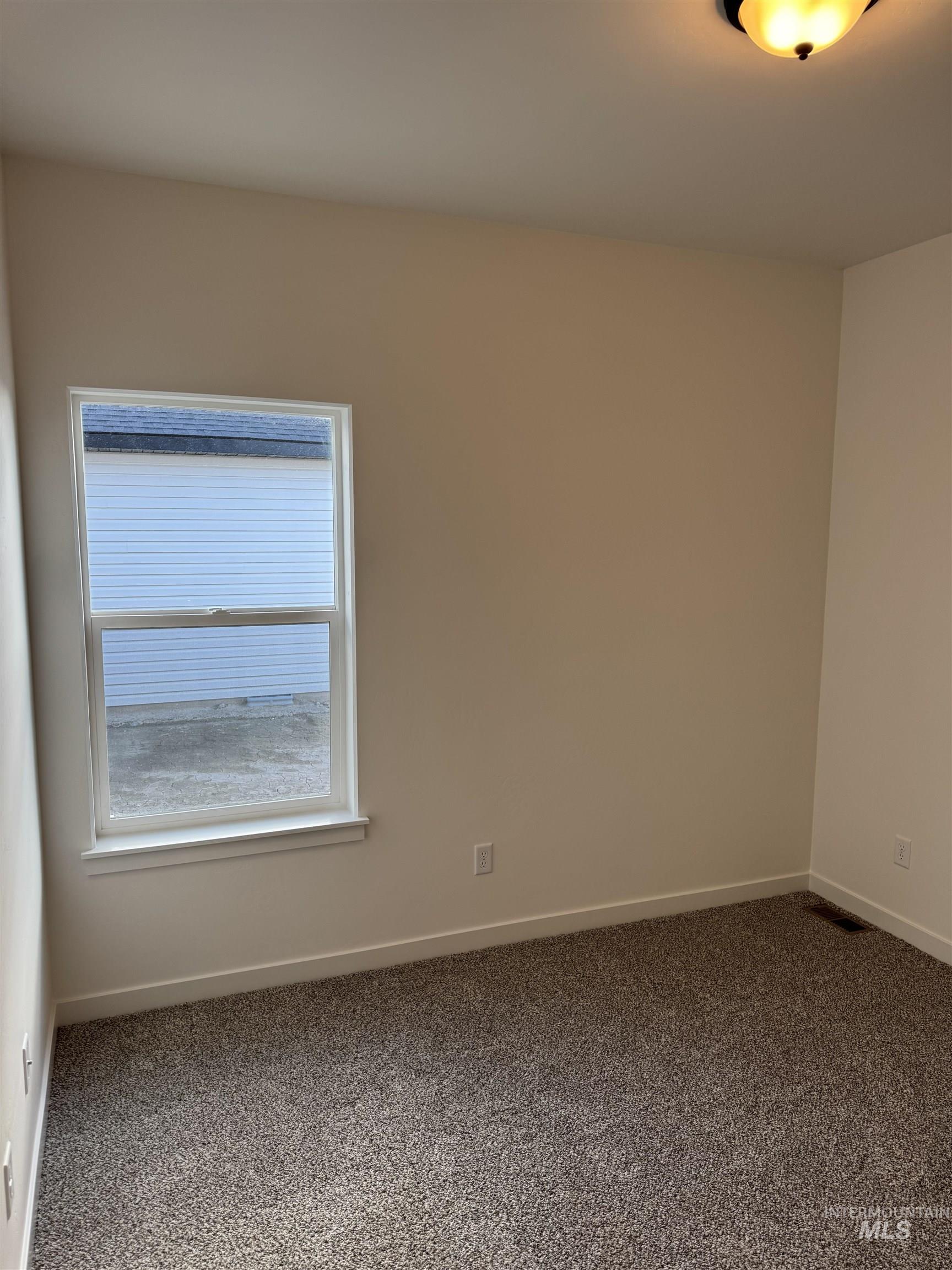 2008 Harrison Street South Twin Falls, ID 83301 - Photo 20 of 32 Empty room with dark carpet